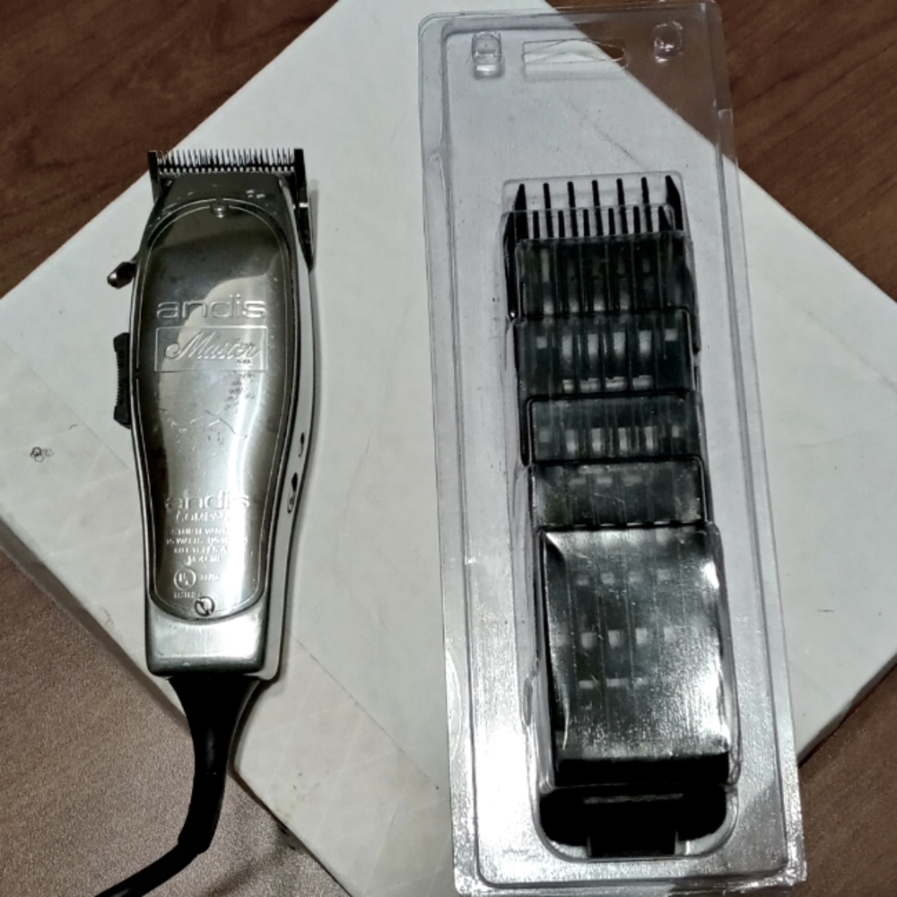 Andis Masters adjustable clipper and guards.